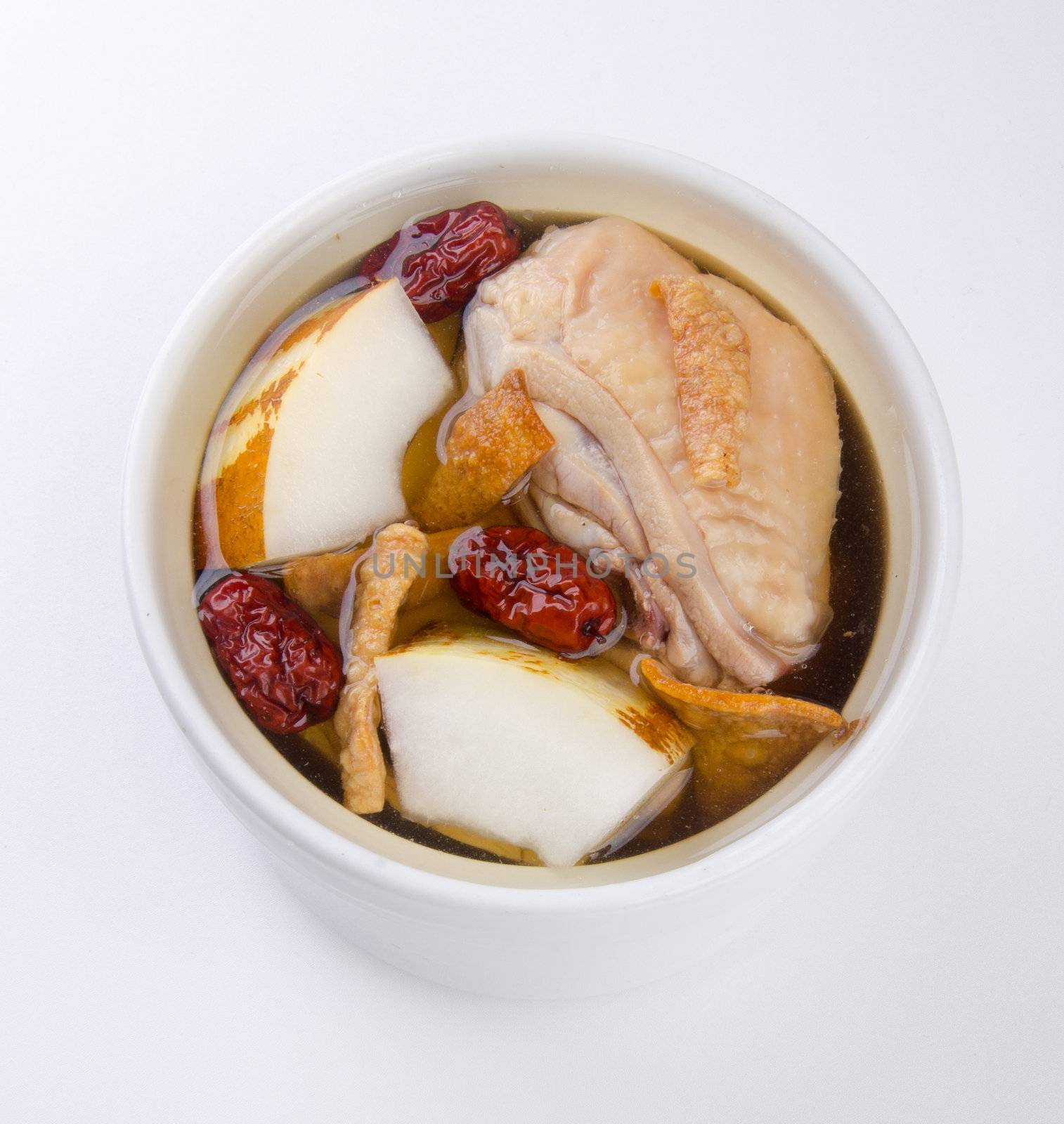 Chicken and herb soup in pot, Chinese food style.