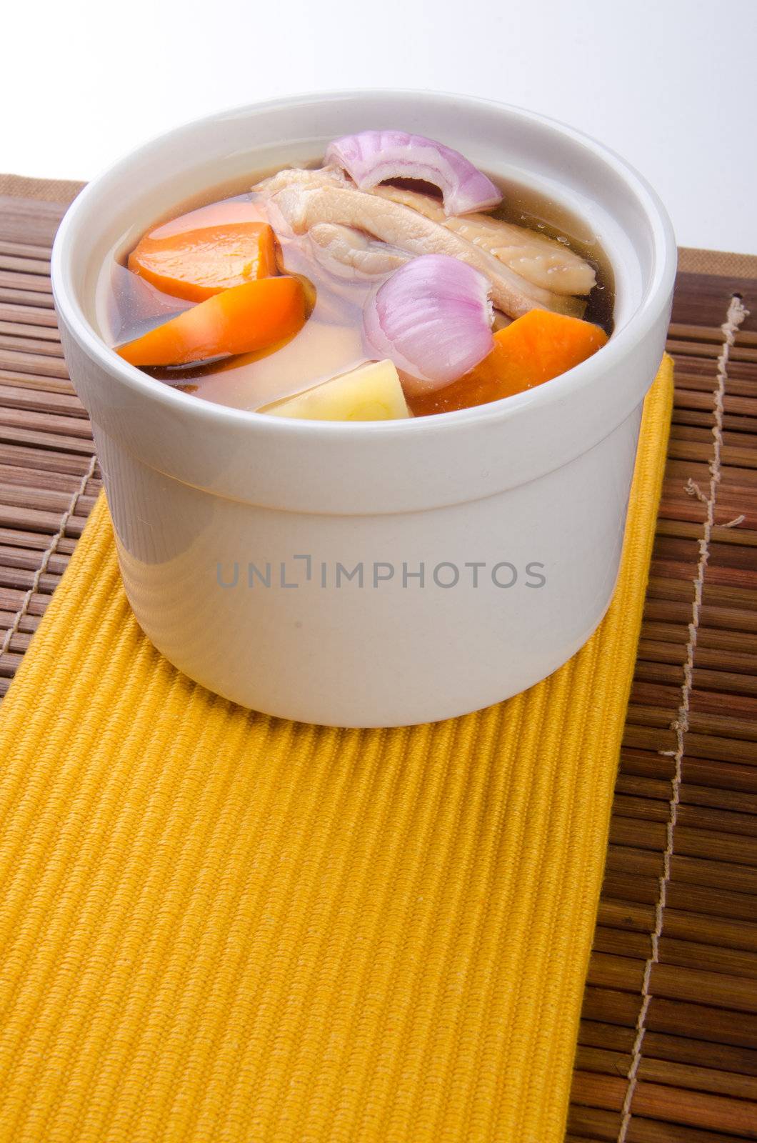 Chicken and herb soup in pot, Chinese food style.