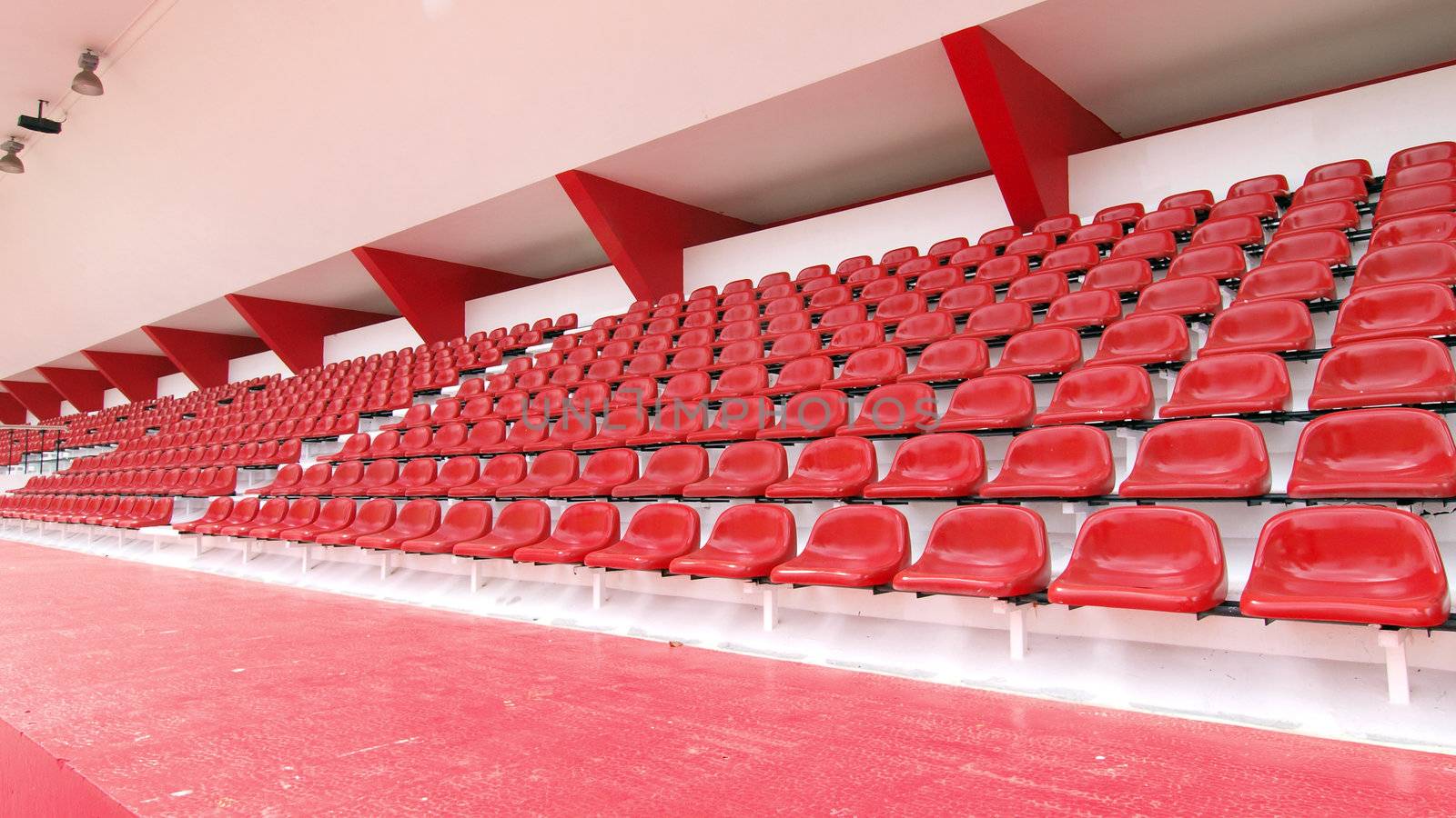 Red seat at Thep Hasadin Stadium in Thailand by jakgree