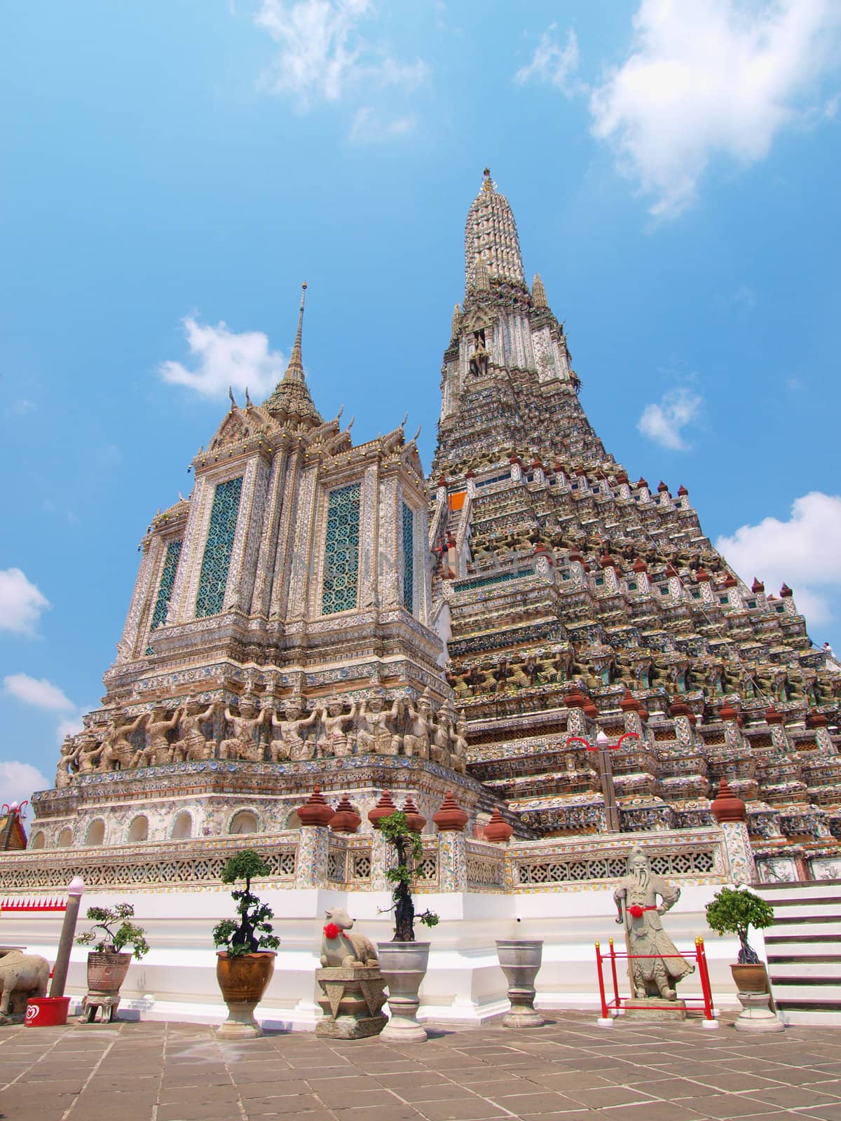 The Temple of Dawn Wat Arun and a beautiful blue sky in Bangkok, by jakgree