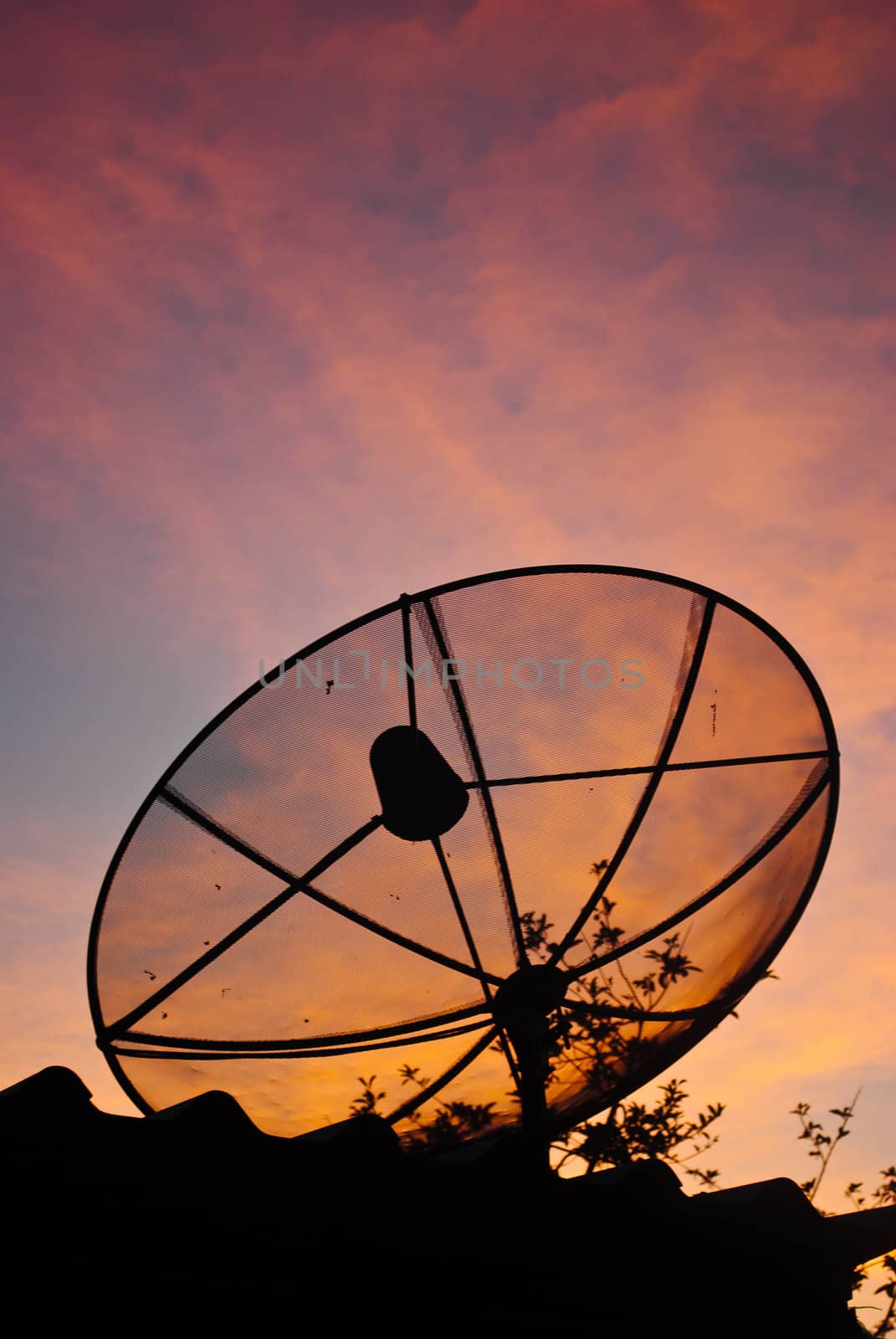 Satellite dish in morning sky
