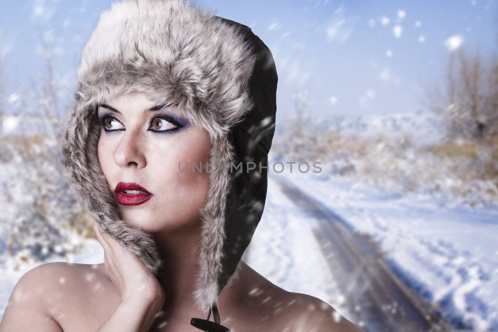 portrait of winter woman with snow
