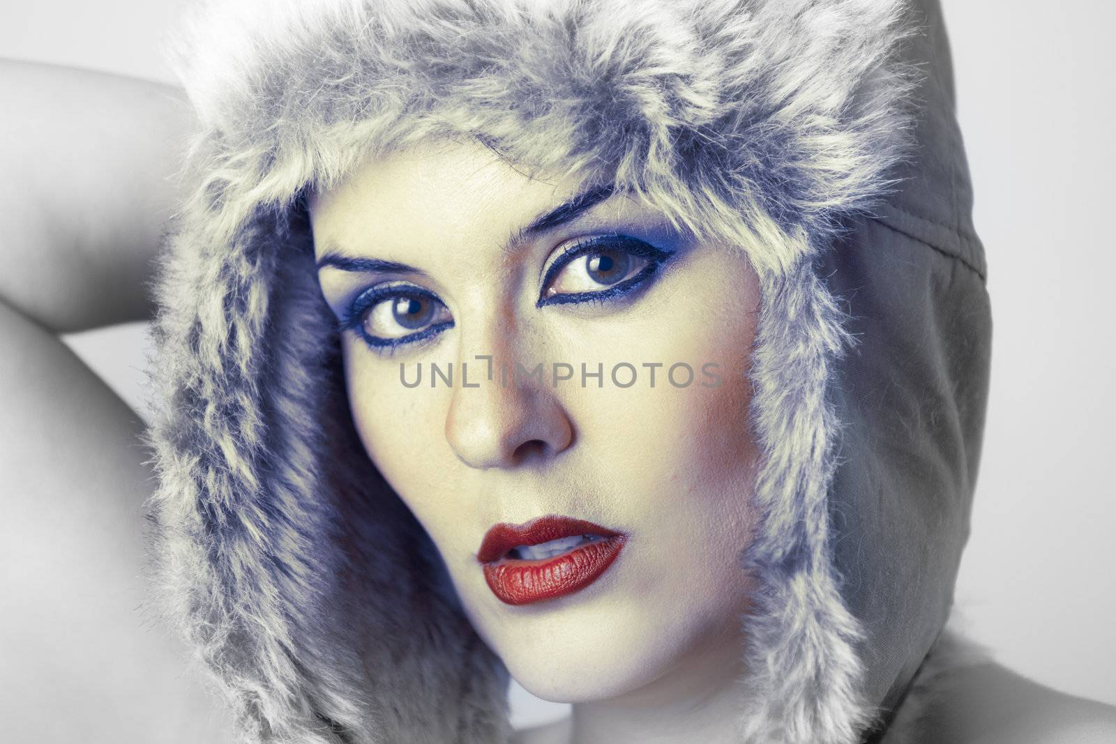 Beautiful winter woman looking over white background