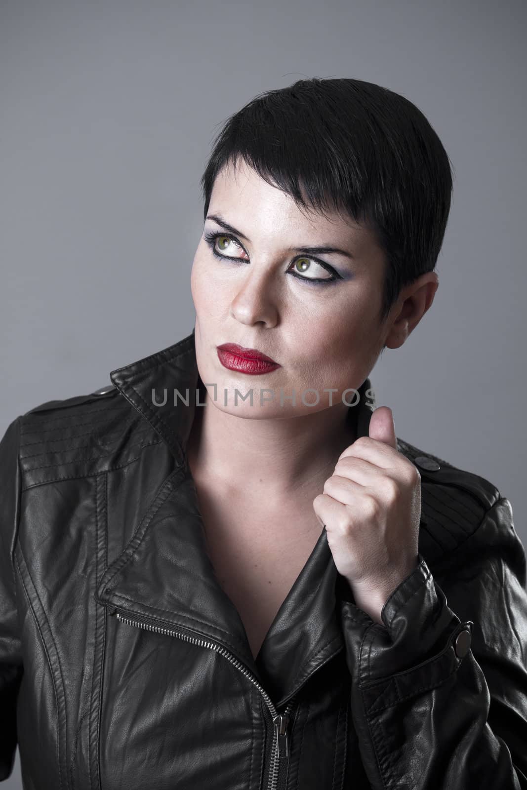 hard woman dark beautiful woman with grey background