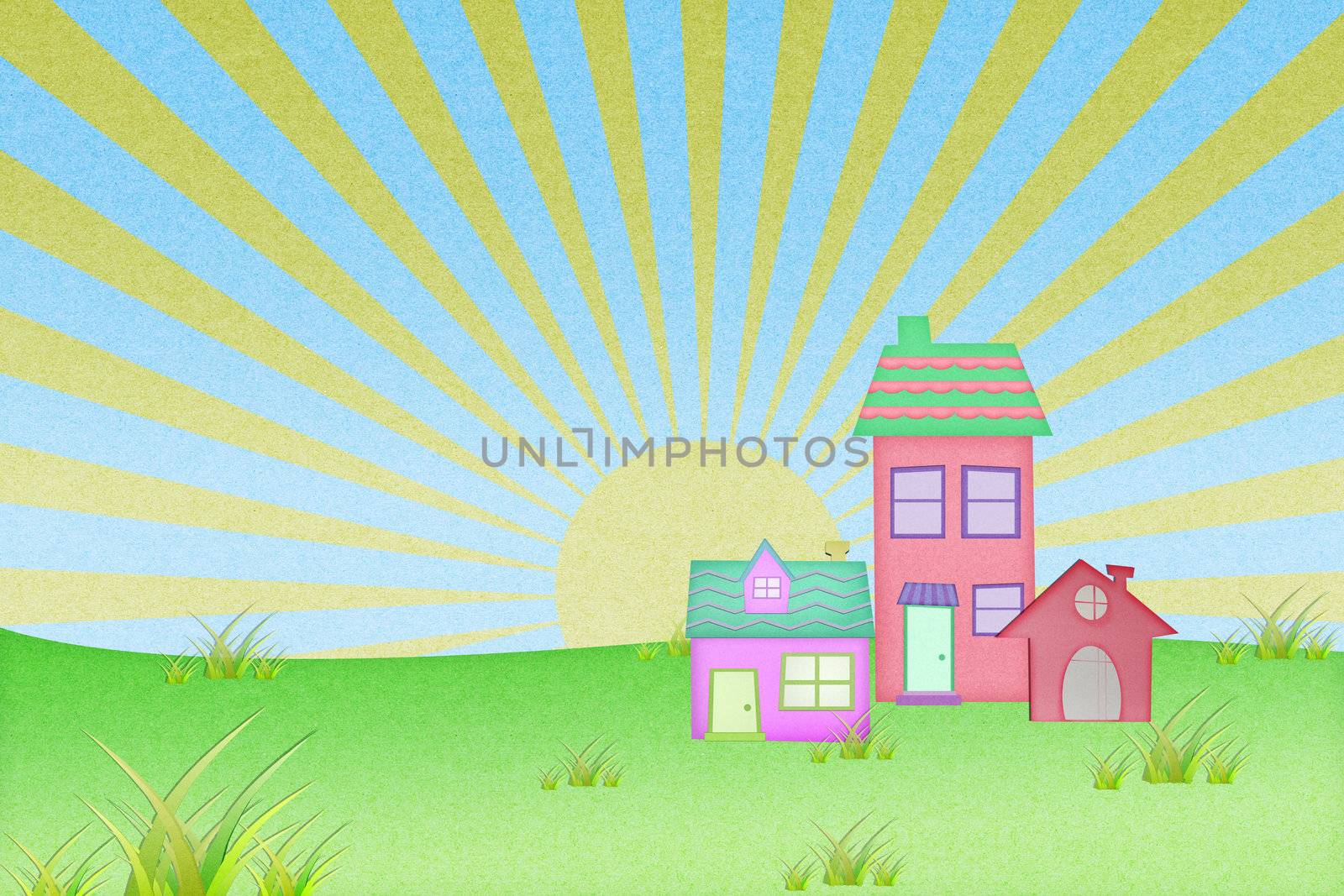 house from recycle paper with grass field and sun set background