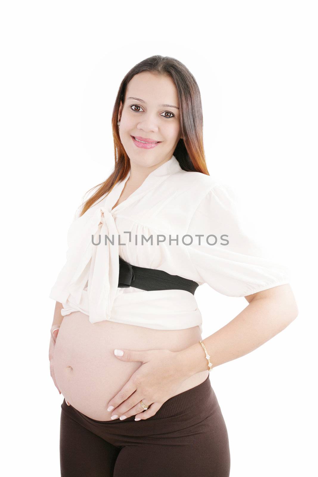 Pregnant happy woman hold her belly with hands looking at camera by dacasdo