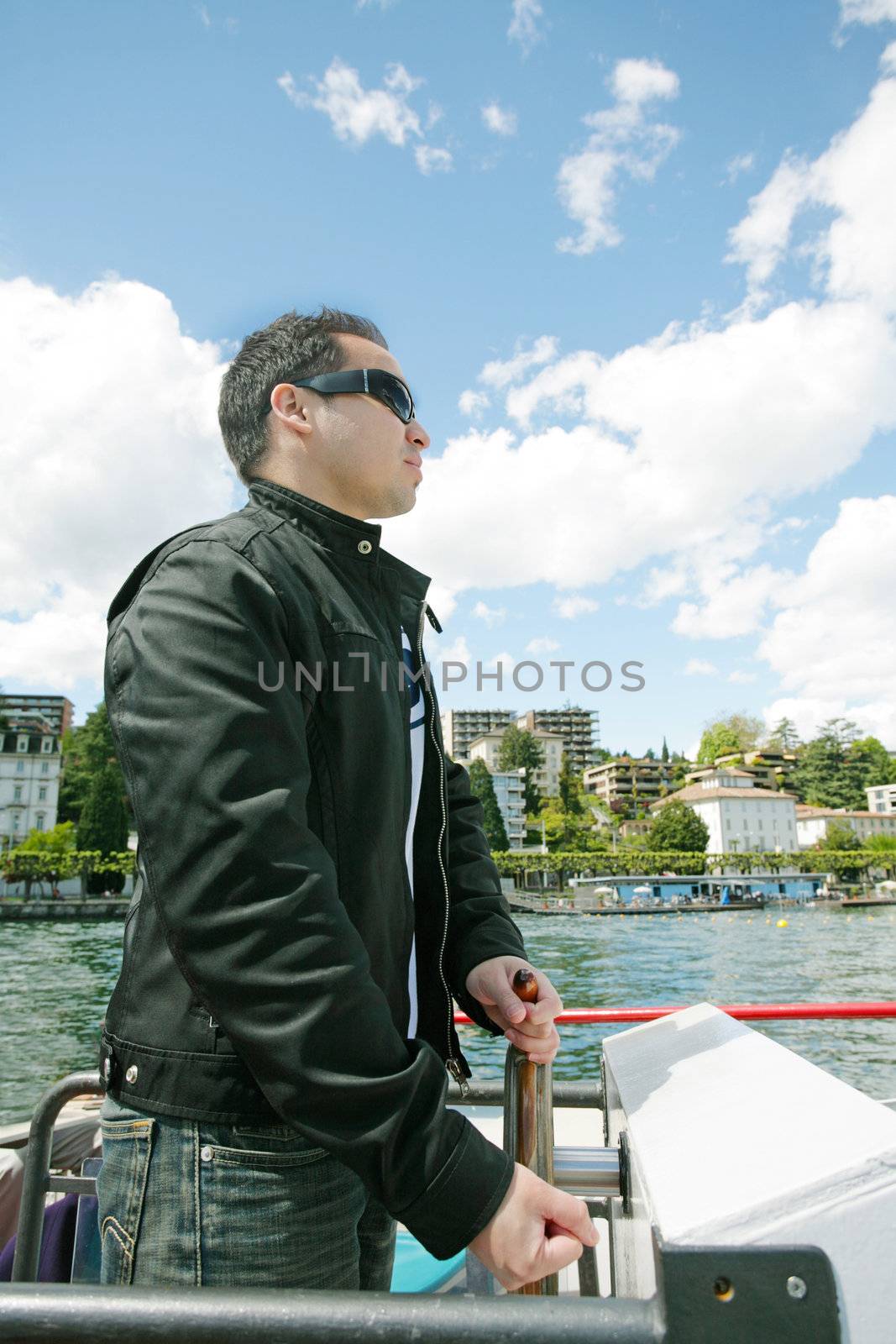 Man boating in Lugano Lake by dacasdo