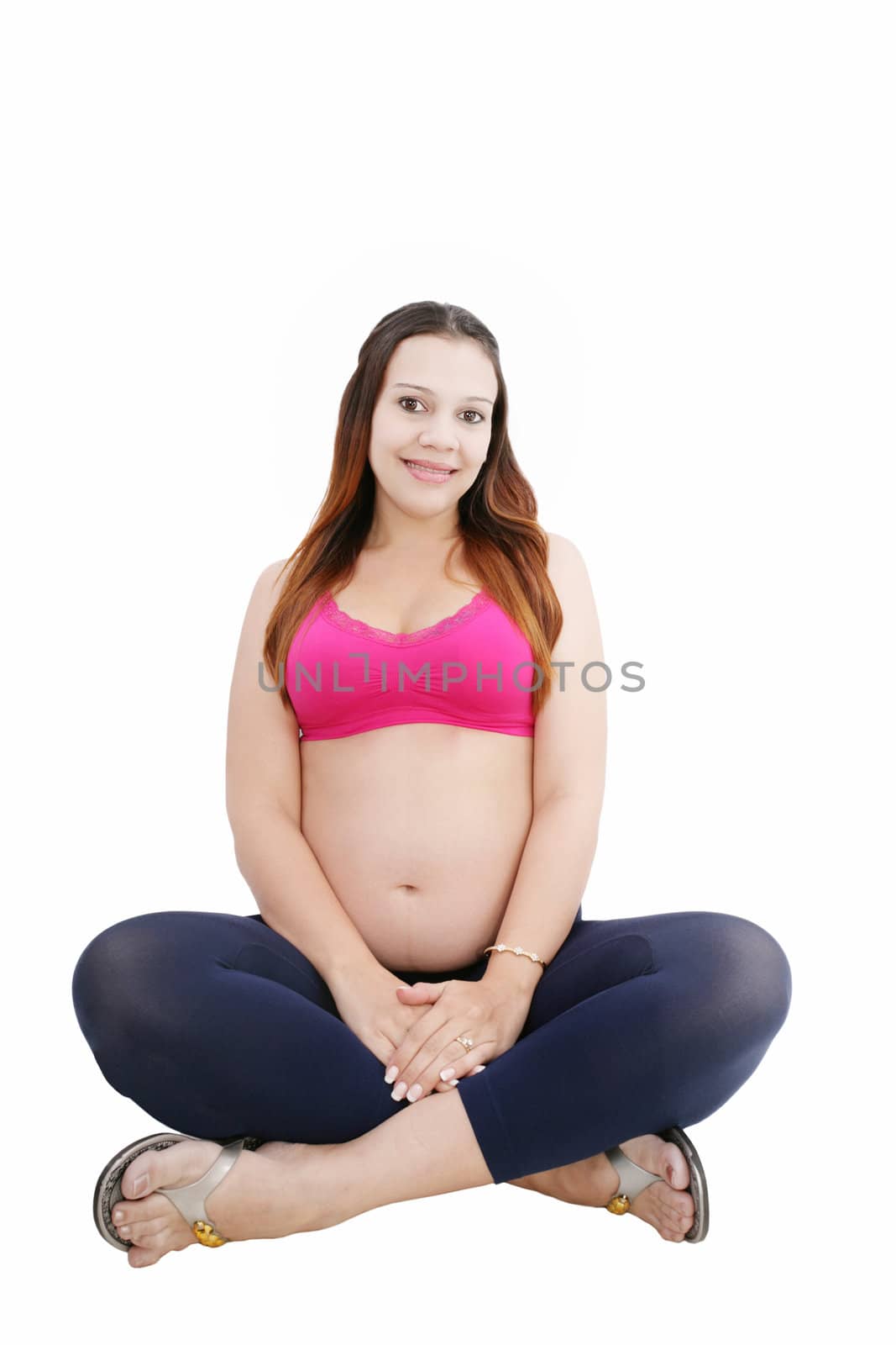 Pregnant woman sitting in floor smiling by dacasdo
