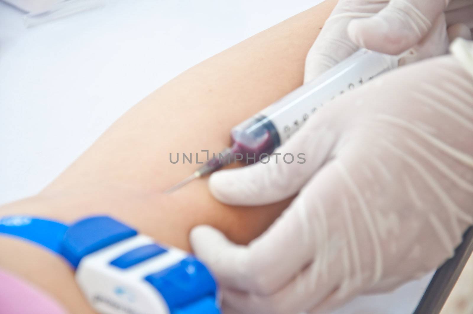 nurse use syringe for test blood and examination