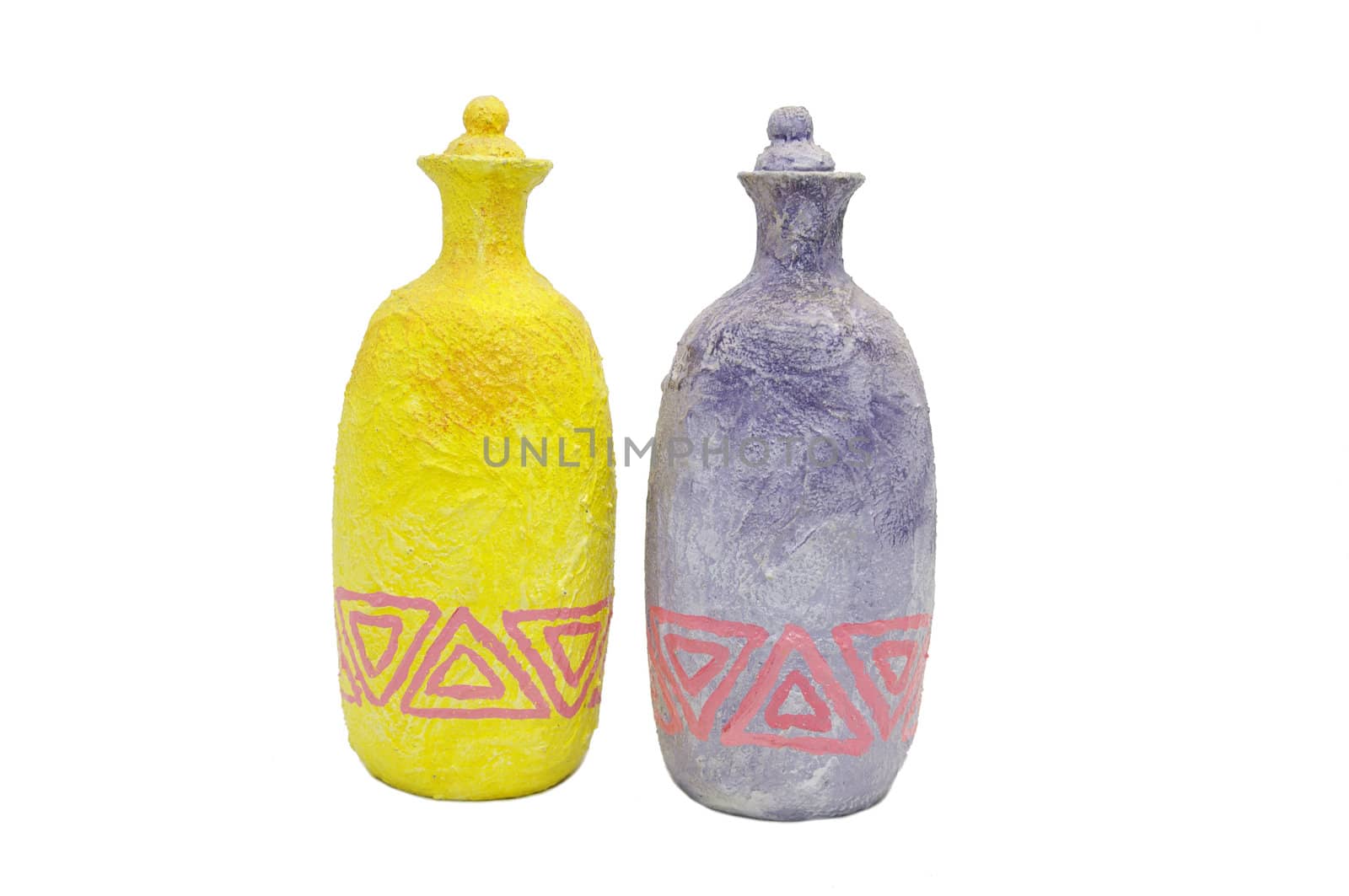 two old colored clay bottles on white background