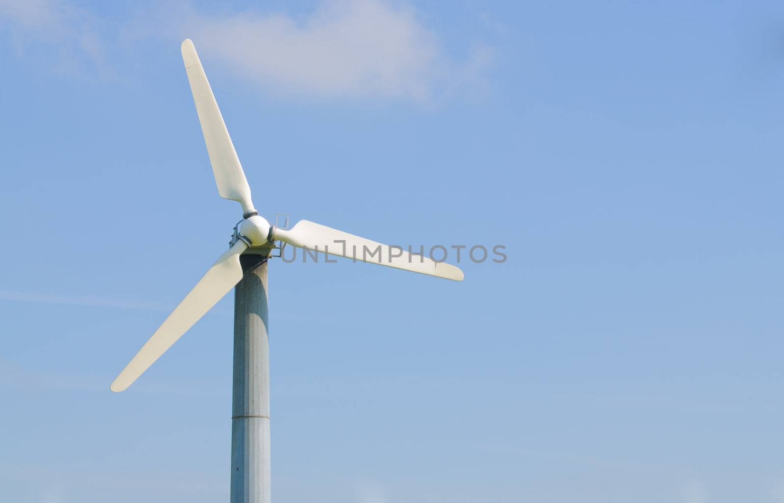 solitary wind turbine on a power generating farm in California, with room for your text