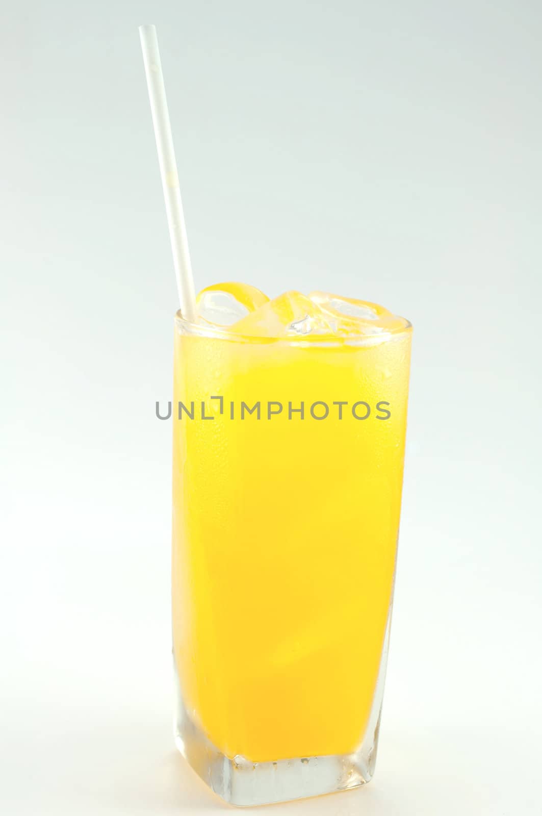a glass of orange juice on white background