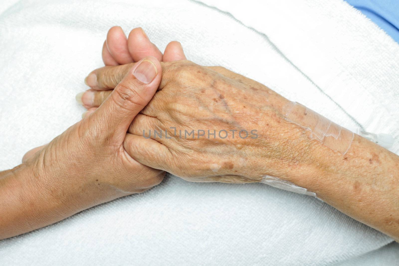 image of Woman Comforting
Hand with her mother.