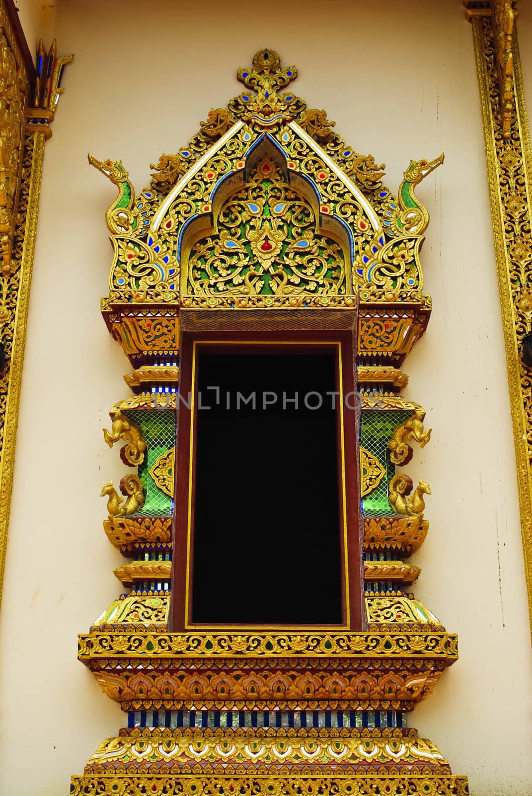Ancient Golden carving wooden window of Thai temple in Thailand.
