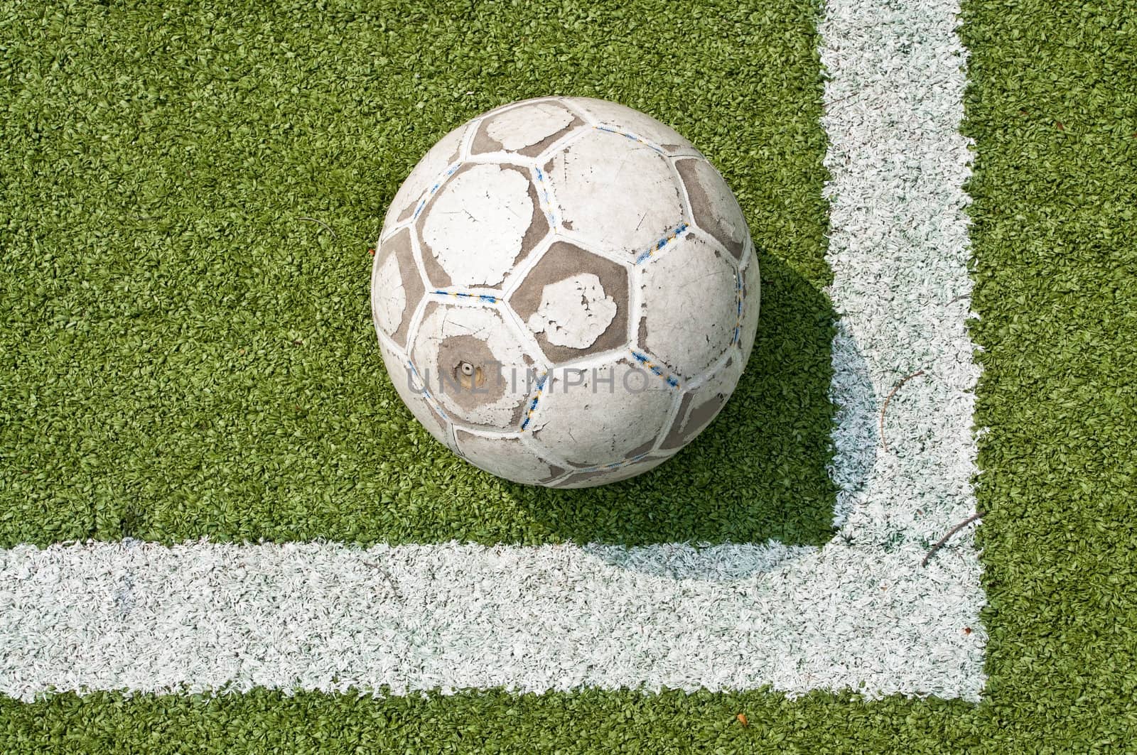 old football or soccer ball on the grass by Yuri2012