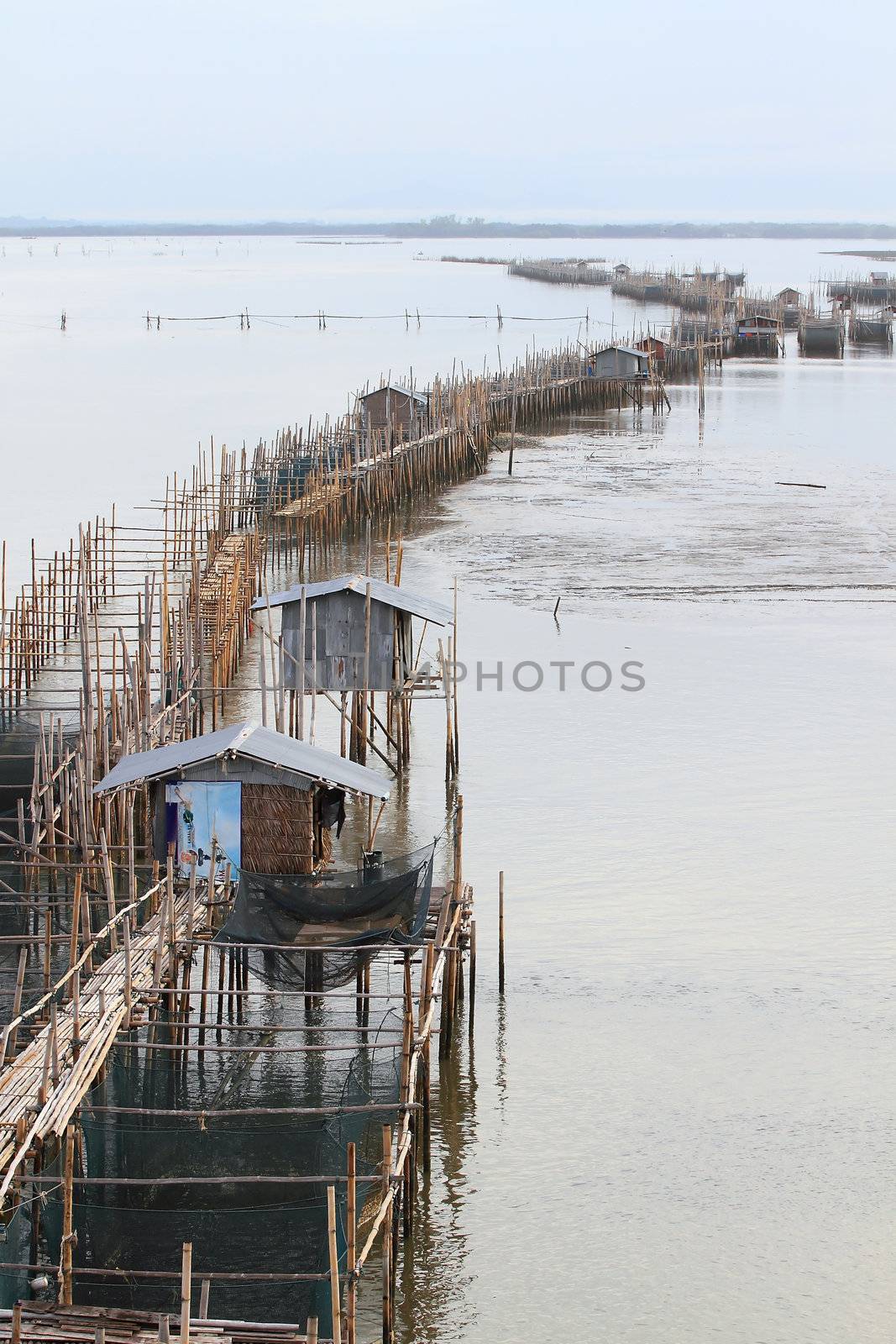 fish farm (floating net for keeping fish in water) at Chanthabur by rufous