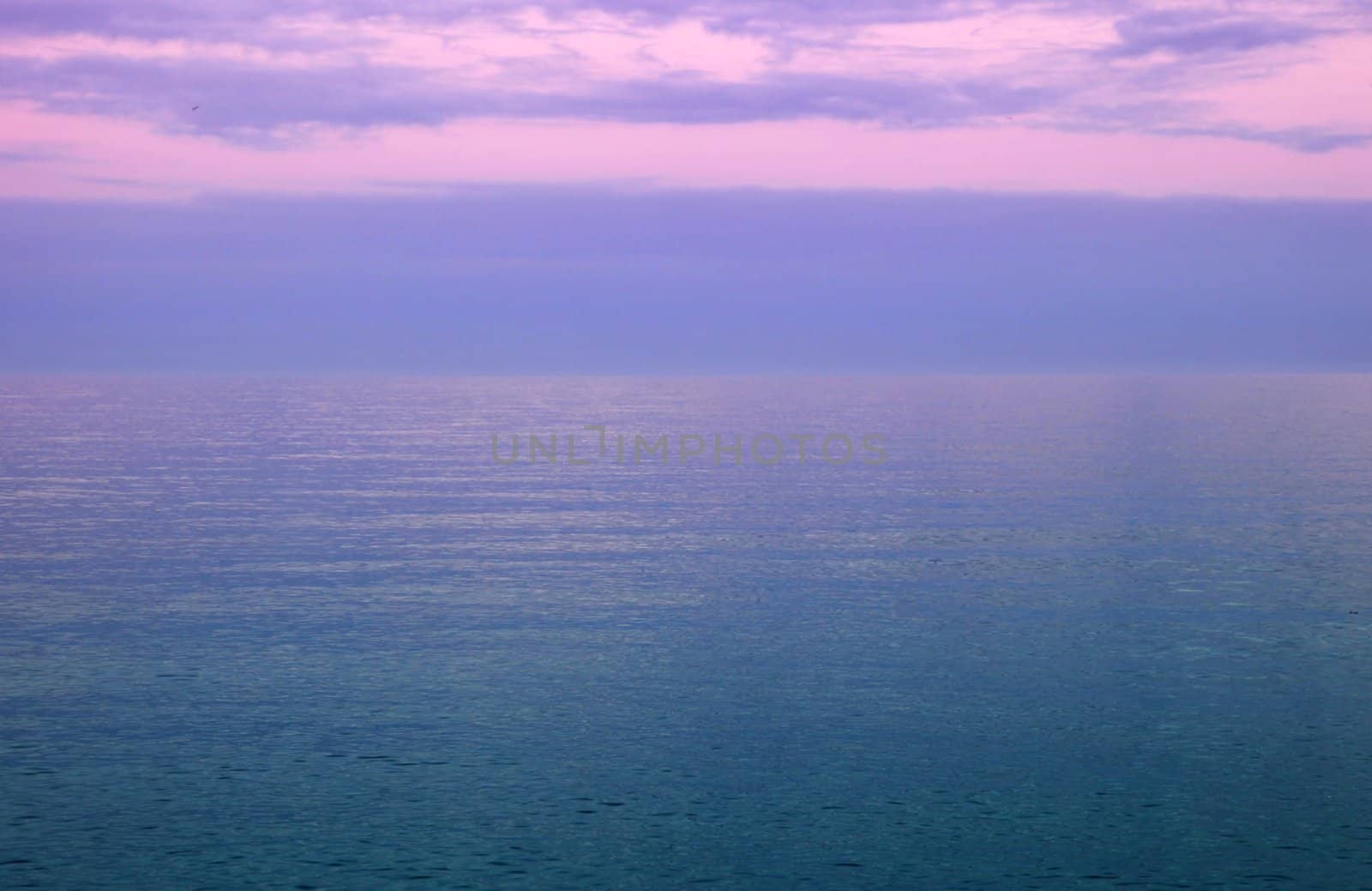 Pink & purple sky over the sea by olliemt
