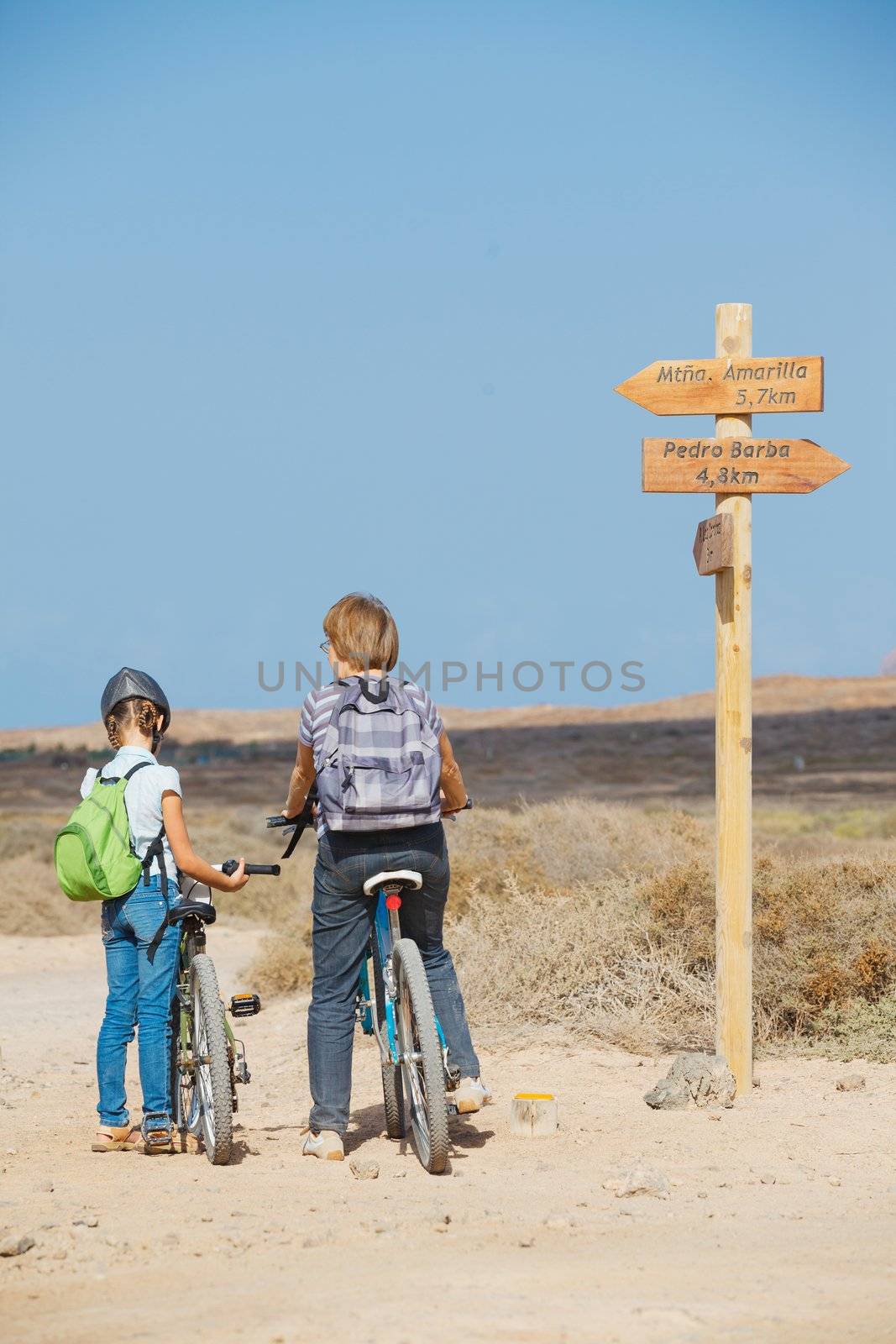 Family having a excursion on their bikes by maxoliki