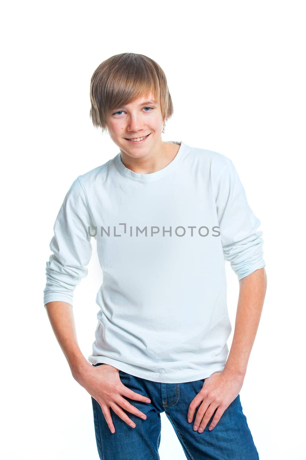 Portrait of young smiling cute teenager in white, isolated on white