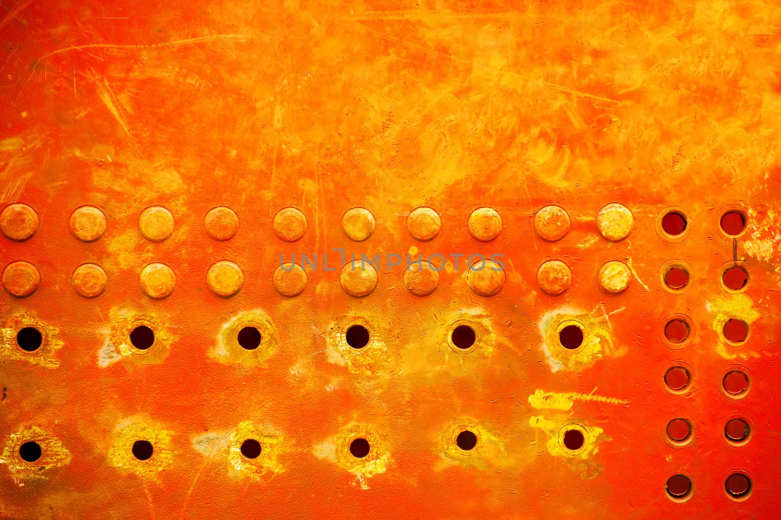 industrial grunge background of sunburst metal rivets