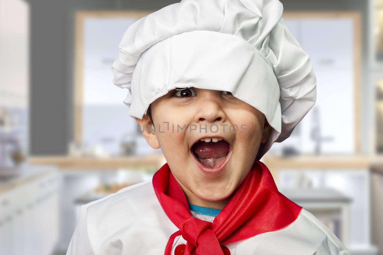 funny child dressed as a cook