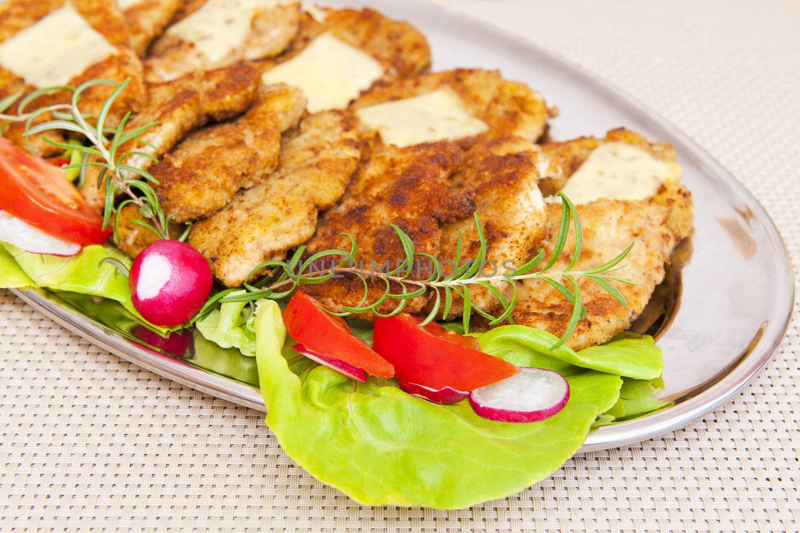 Breaded meat on the silver plate