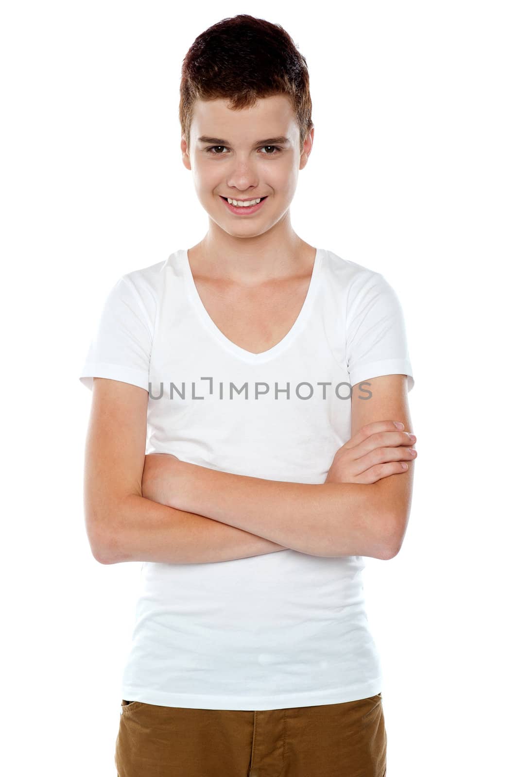 Smiling boy posing with crossed arms isolated on white background