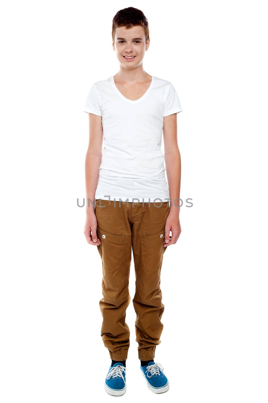 Full length shot of trendy young caucasian boy posing against white background
