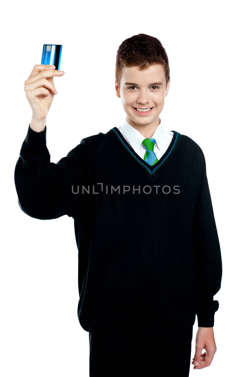 School boy holding credit card isolated over white background