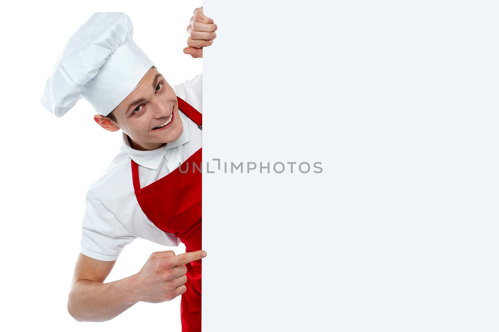 Male chef indicating at blank menu isolated over white background
