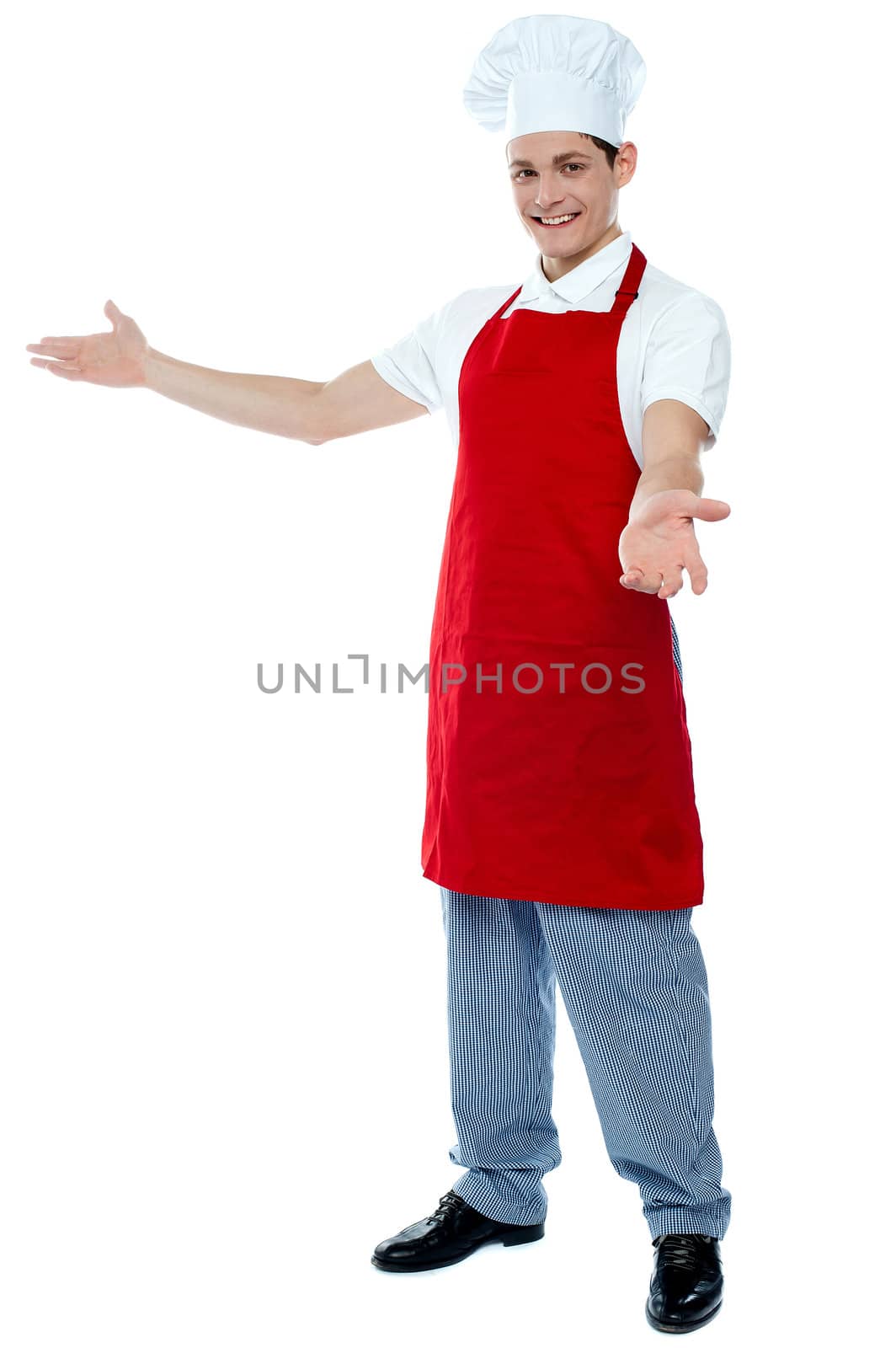 Portrait of a male chef in red uniform posing with his arms wide open