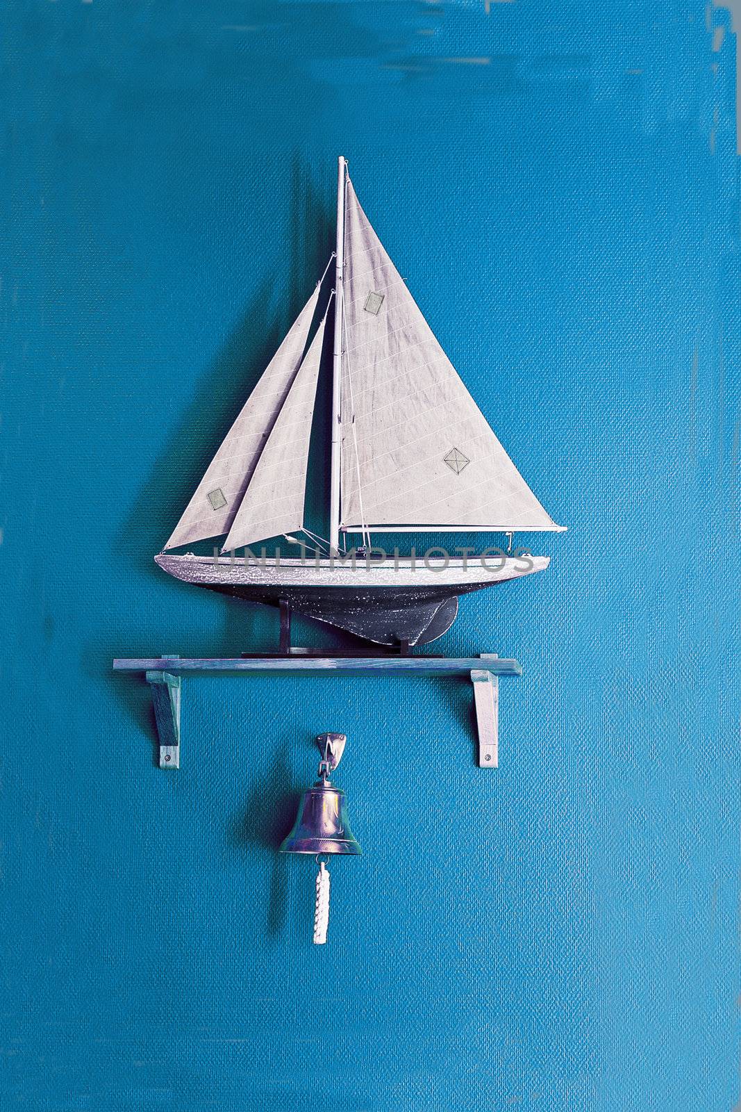 Sailboat on the blue wall background