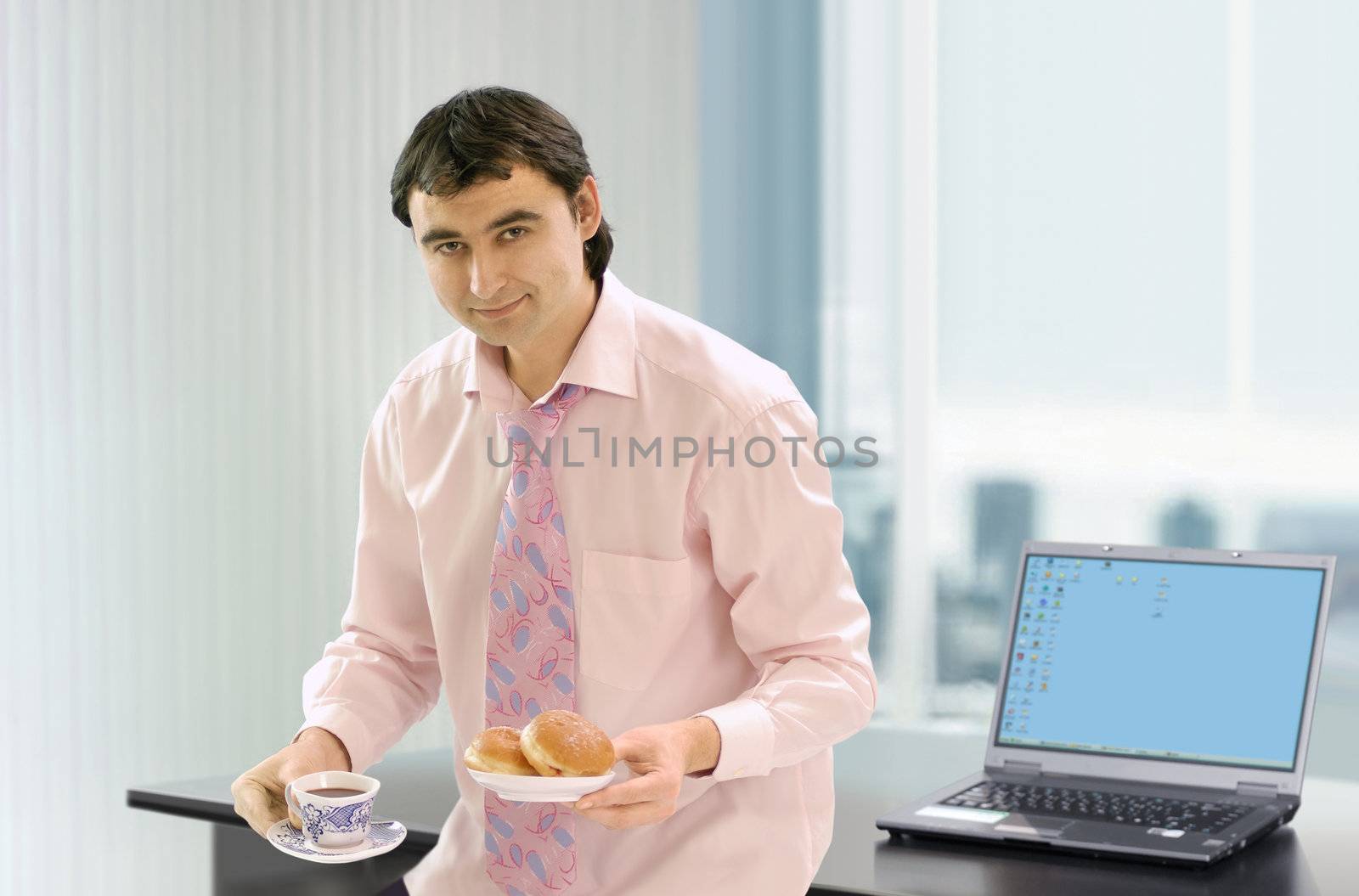 businessman near his work place that has a coffe break