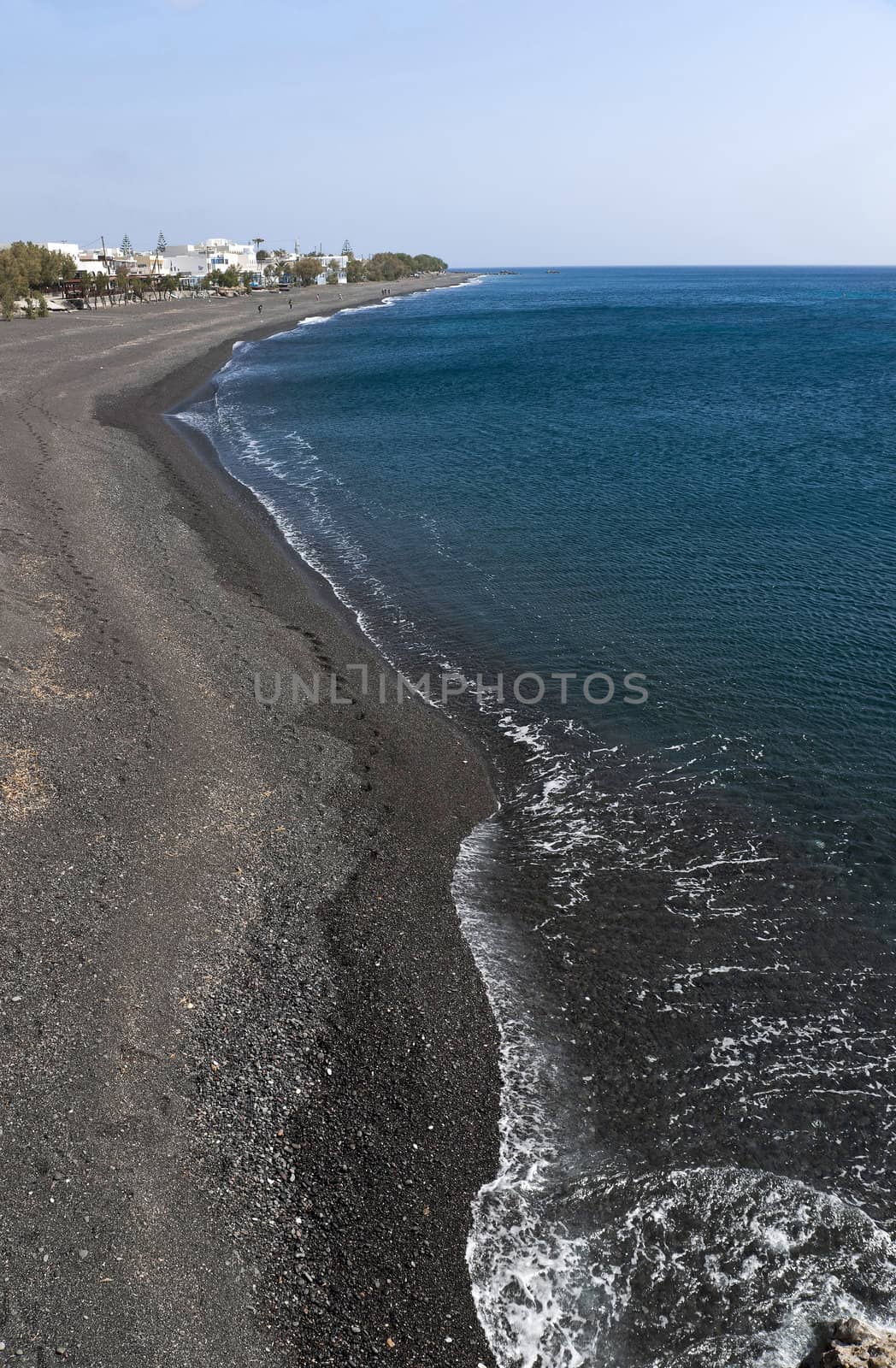 Kamari black pebble beach in Santorini island