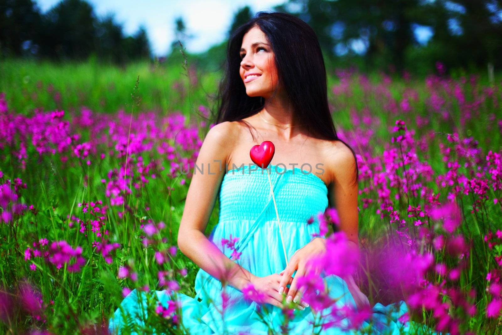 woman on summer flower field