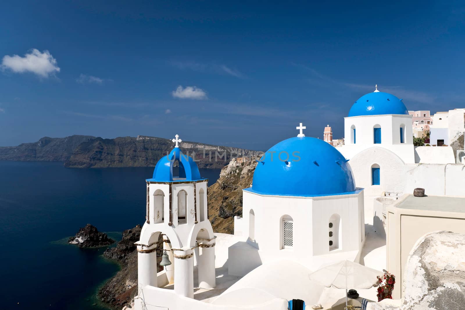 Famous Santorini churches with blue cupolas