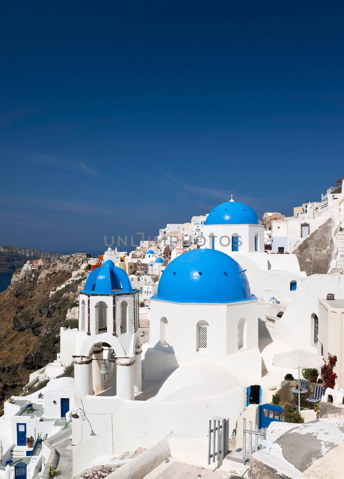 Famous Santorini churches with blue cupolas