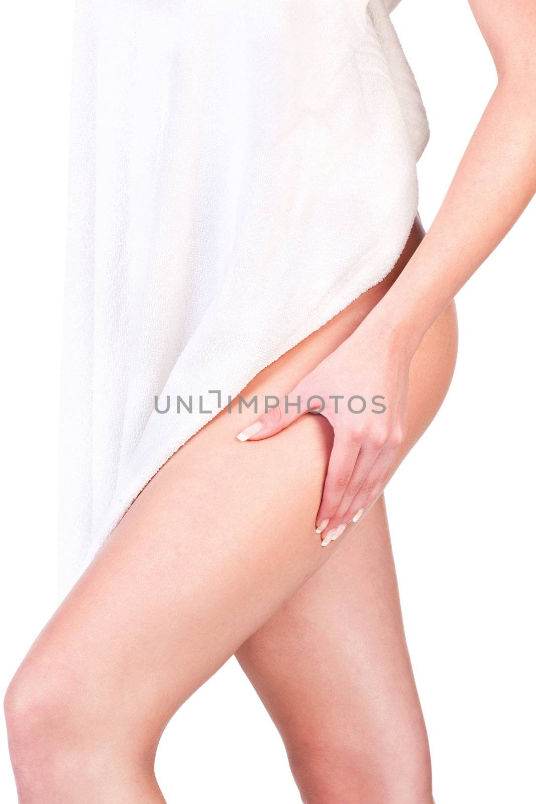 Woman with towel pinching leg for skin fold test, isolated on white