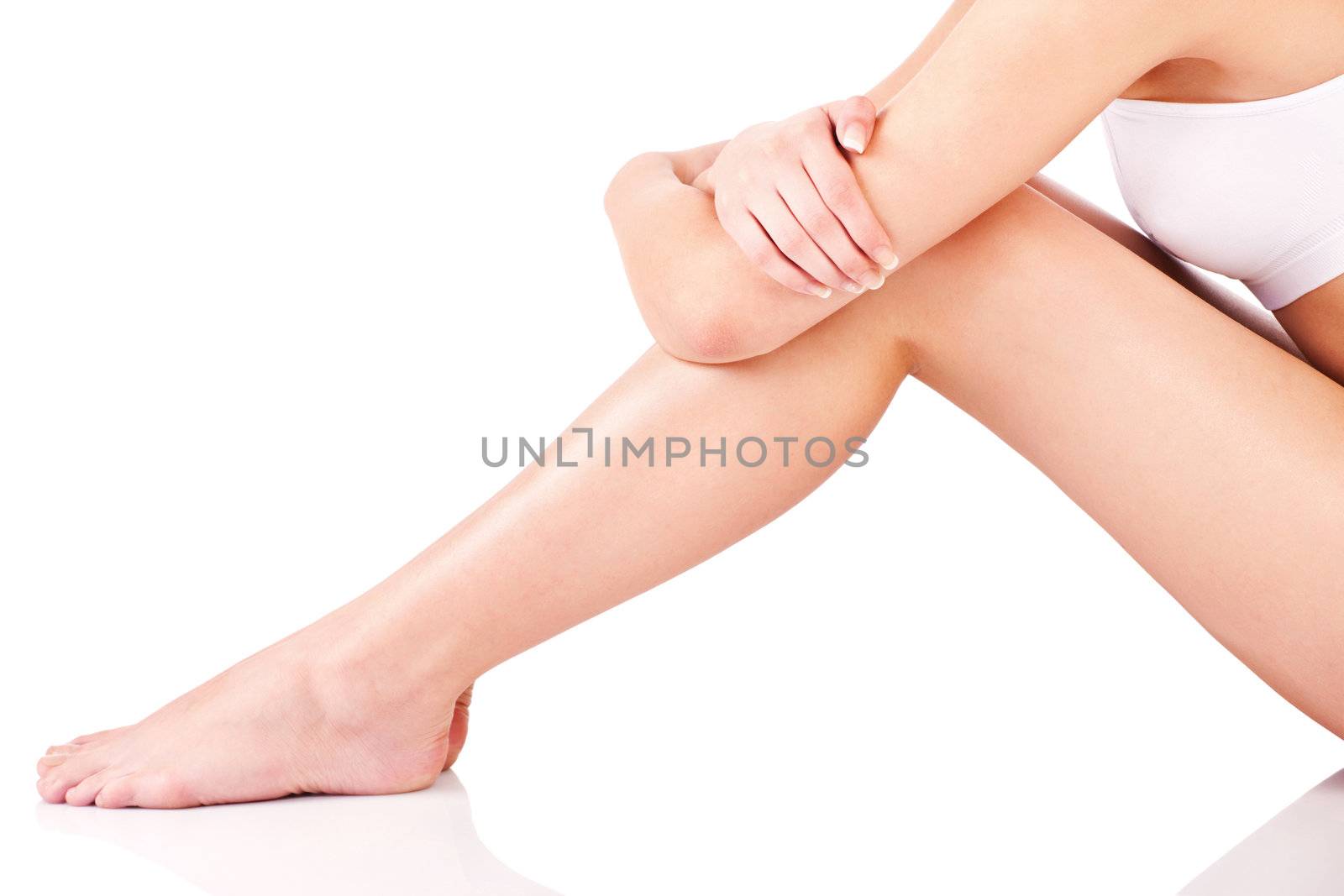 Legs and part of a female body, isolate on white background
