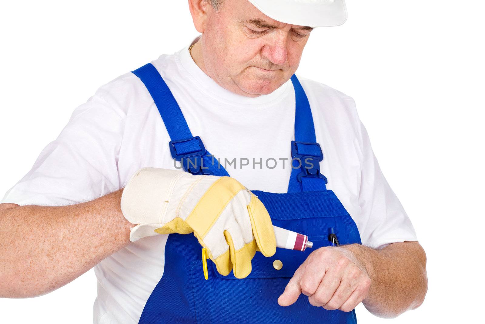 Middle age worker putting cream on his wound, isolated on white background