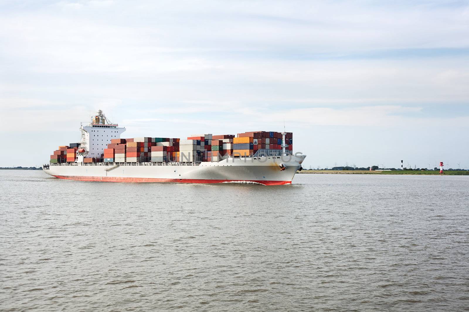 Container ship on river Elbe, Germany