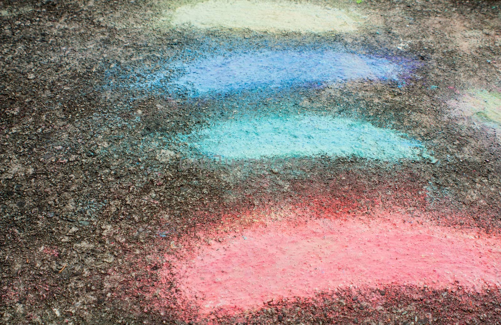 Closeup photo of chalk color pattern on asphalt