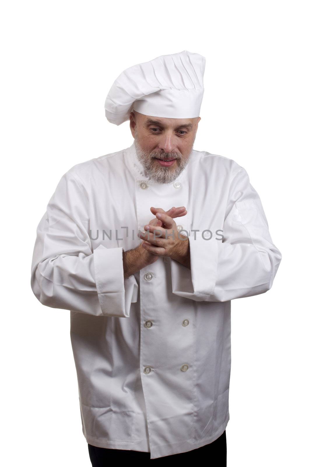 Portrait of a caucasian chef in his uniform on a white background.