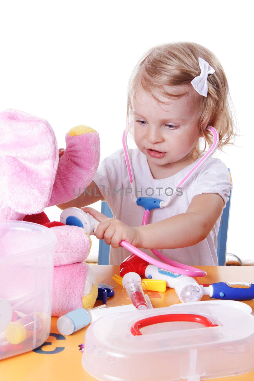 Little girl playing as doctor with stethoscope by Angel_a