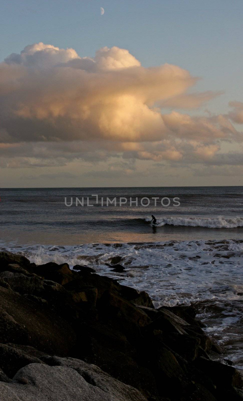 Surfer in the sea at Sidmouth in Devon by olliemt