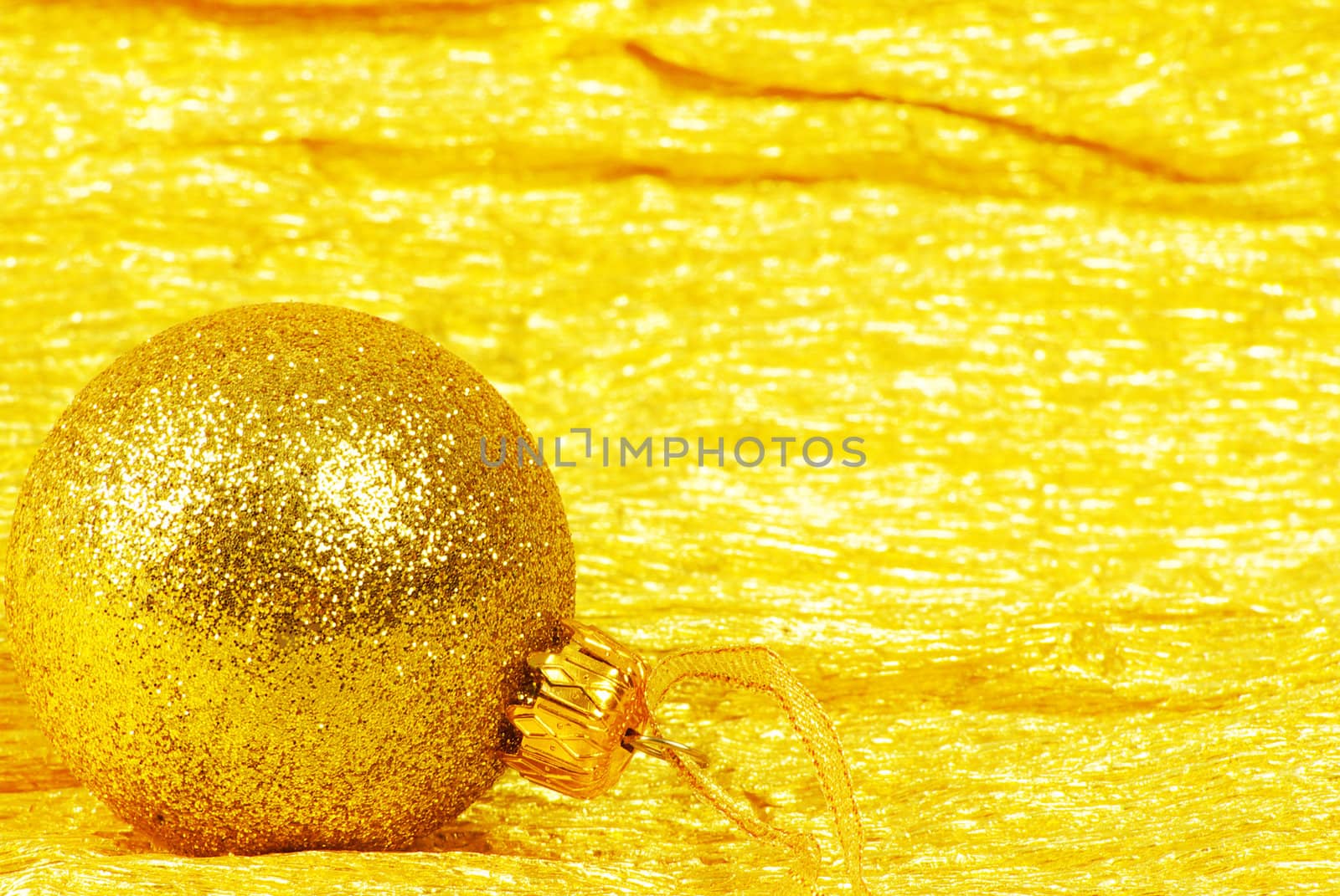 Christmas ball on golden background