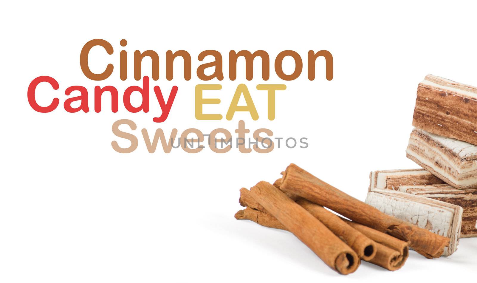 Sweets and cinnamon sticks isolated on white background