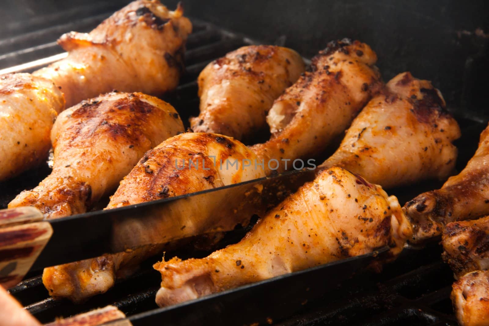 Chicken drumsticks on the grill