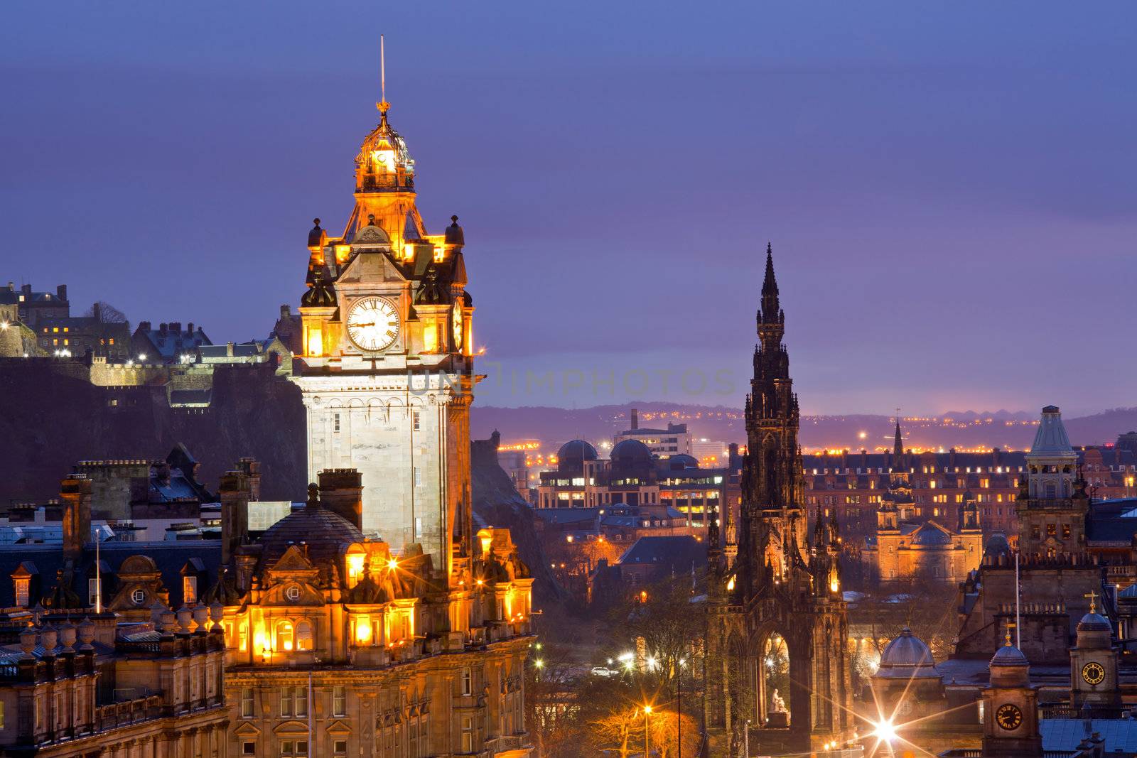 Edinburgh Clock Tower and scott monument from Calton Hill at dusk Scotland UK