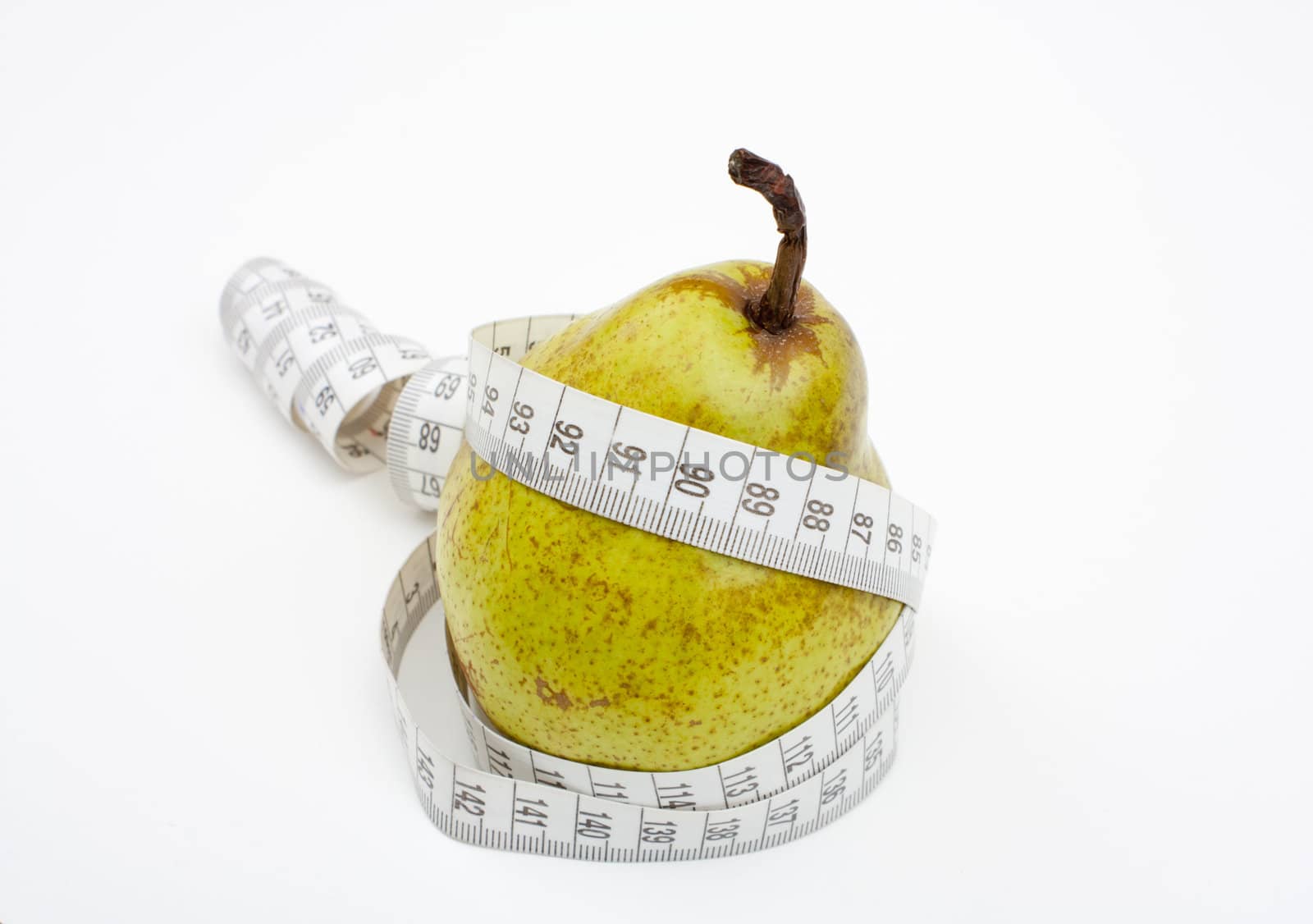 Tape measure wrapped around the pear, close-up.